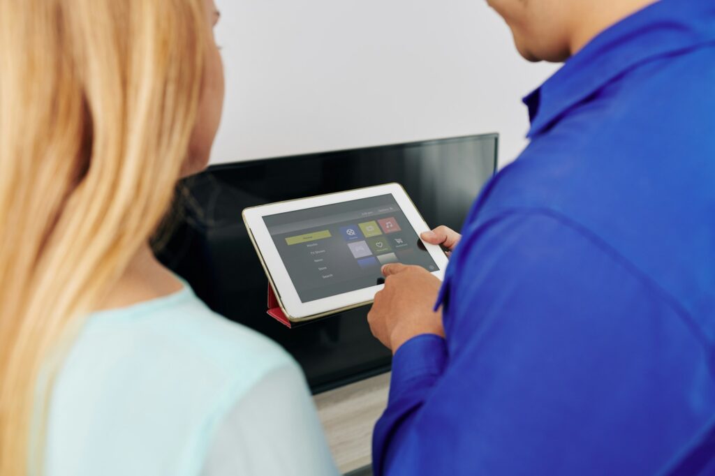Technician showing smart home app
